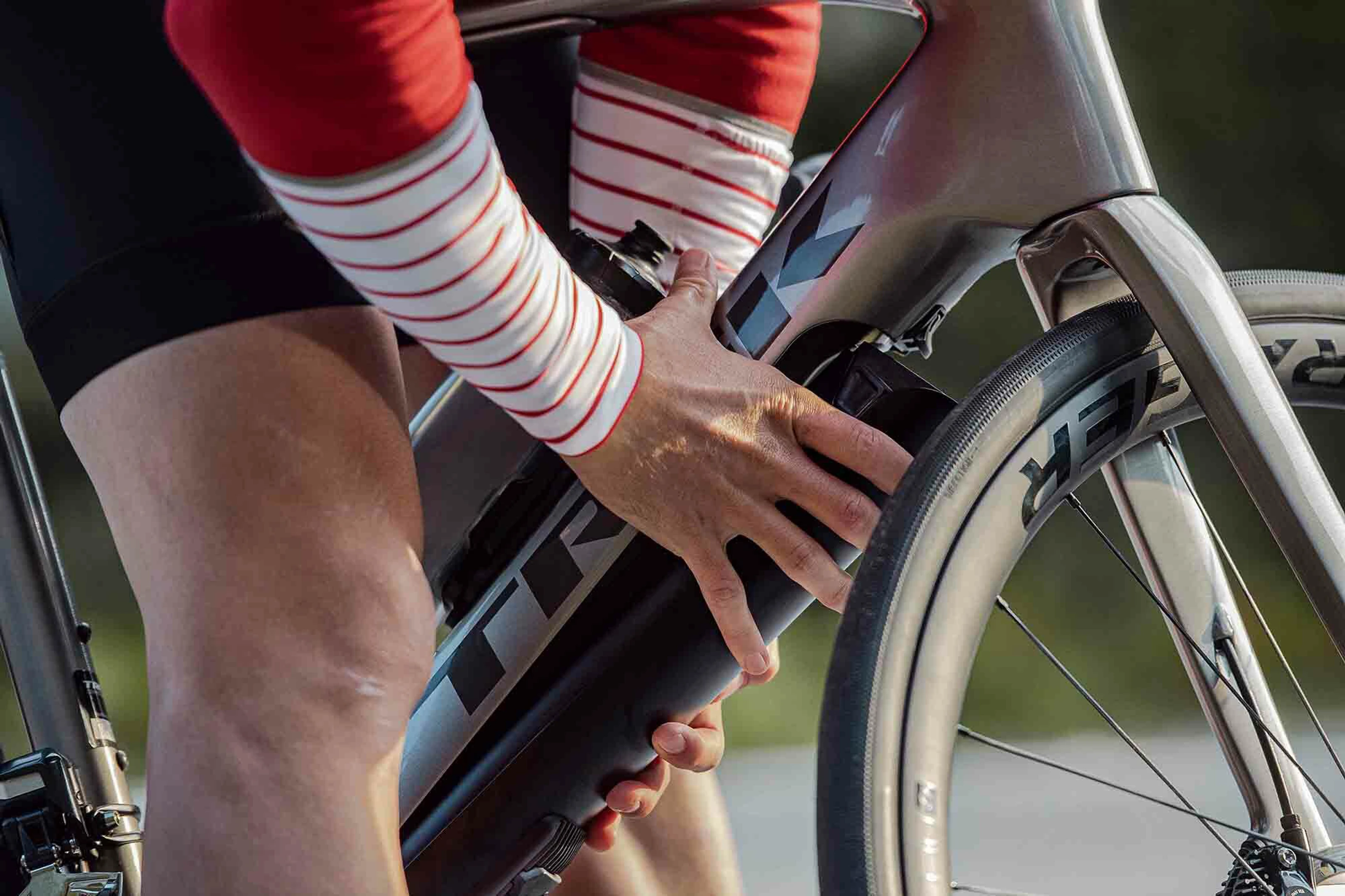Photo of man inserting an e-bike motor into a bike