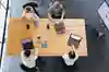 Four people in a meeting, photographed from above